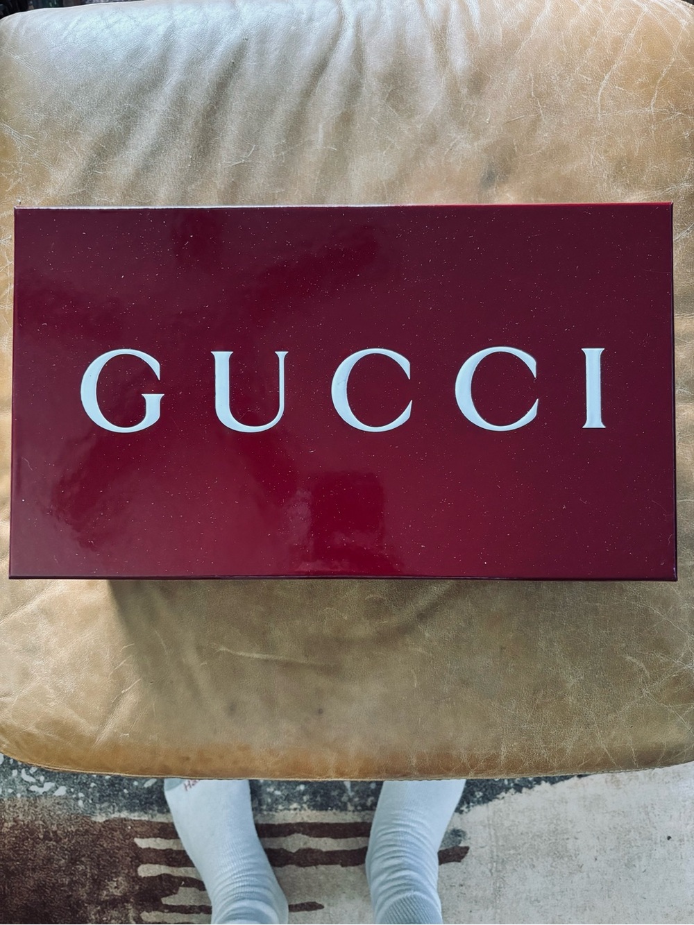 Gucci White Lettering on Deep Burgundy Wall Sign